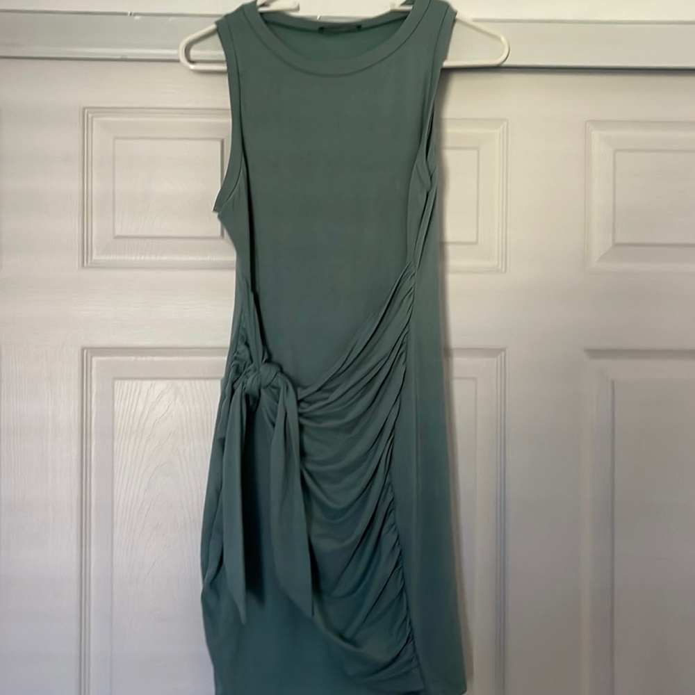 Tight fitting dress with scrunch in the front